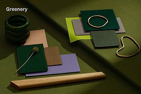 This mood board features fresh shades of green, earth tones, and pastels, complemented by golden accents. The fabric swatches convey a vibrant, organic, and modern atmosphere that pairs well with biophilic or nature-inspired design styles.