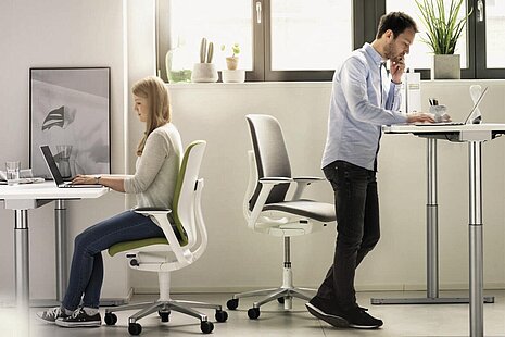 AT swivel chairs in modern office environment, mixed seated and standing workstation scene