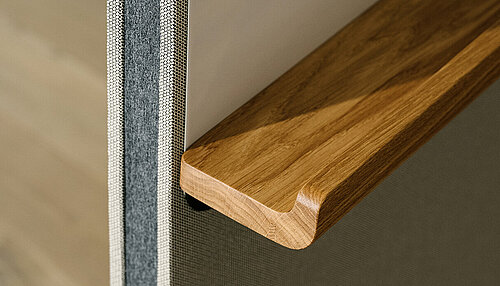 Confair Next, detail view of wooden accessory shelf