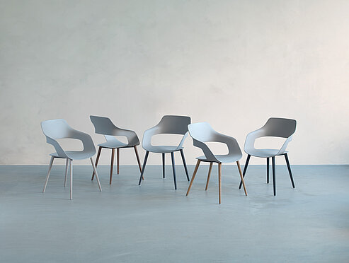 Occo Wooden-Legs chairs in minimalist studio setting, product family overview