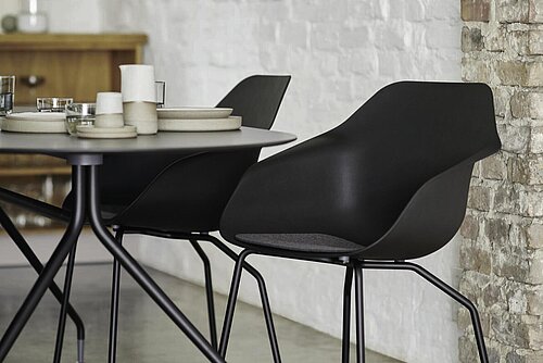 Yonda chairs in dining area, table setting scene