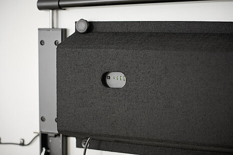 A black felt cover to conceal and house the technical components of the timetable.