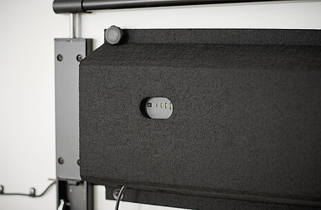 A black felt cover to conceal and house the technical components of the timetable.