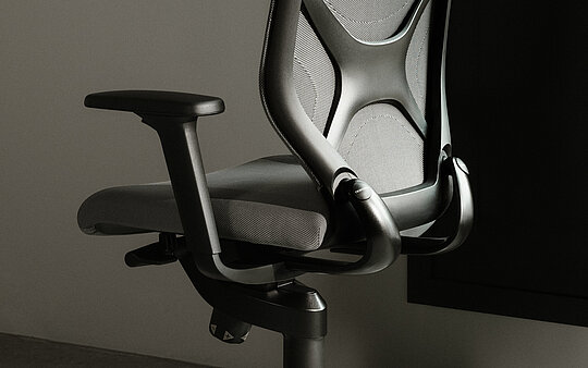 IN-Swivel-Chair, cut-out, rear three-quarter view, black mesh
