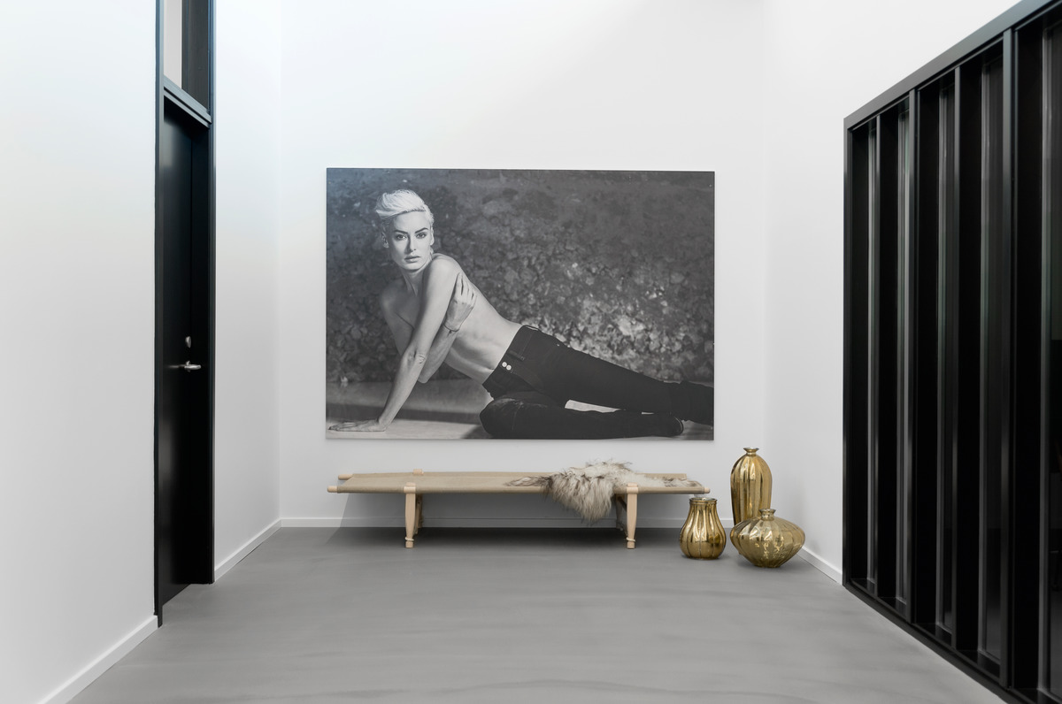 Just like the walls and doors, the large black and white photos amplify the impact of the vintage elements.